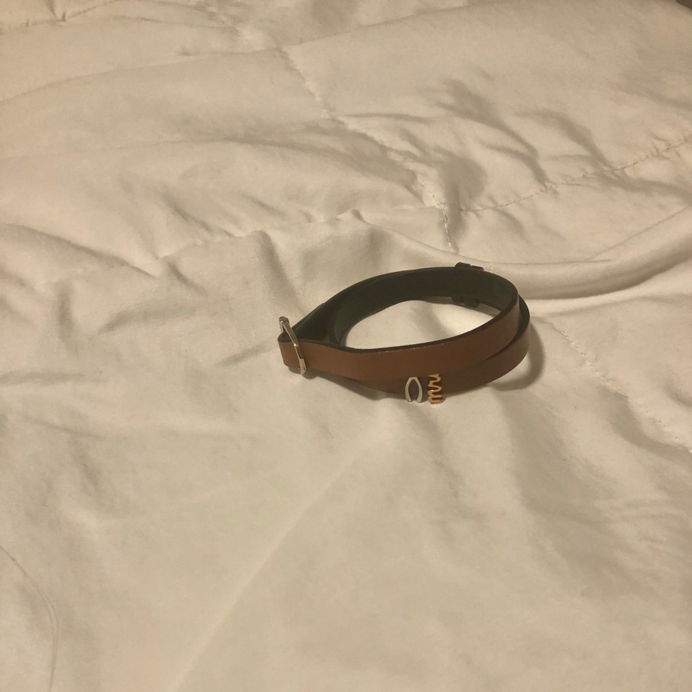 Wrap bracelet with two charms.